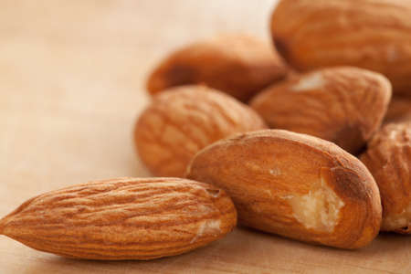 Almonds on wooden background.の写真素材