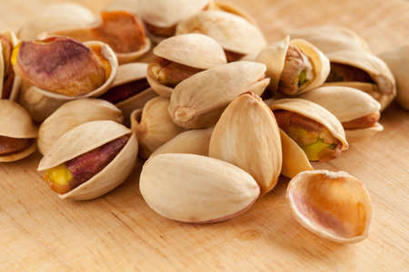 pistachio close up on wooden backgroundの写真素材