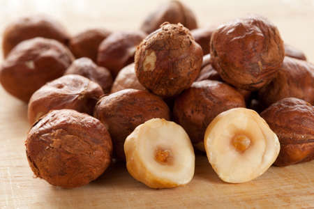 Ripe hazelnuts on wooden surfaceの写真素材