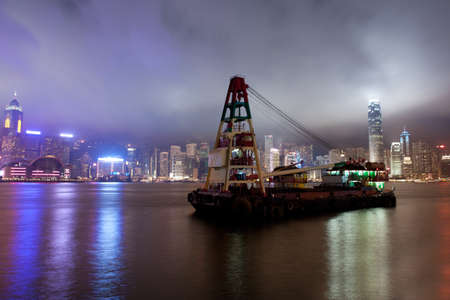 Night mysterious view of foggy Hong Kong waterfrontの写真素材