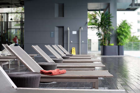 A towel on a beach chair under the rainのeditorial素材