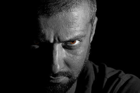 Dramatic veiw of a man face in darknessの写真素材