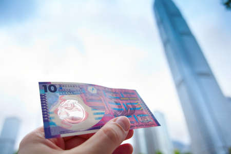Ten Hong Kong dollars against blurred 2 IFCの写真素材