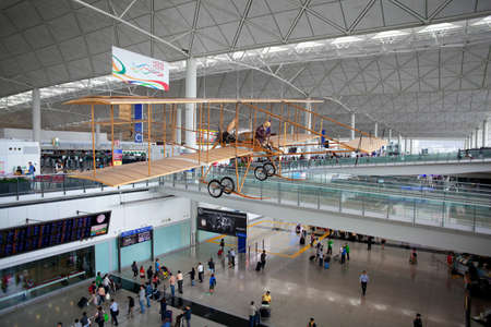 HONG KONG - APRIL 18, 2012: A replica of the 1910 Farman aircraft hangs in Hong Kong International Airport. The original Farman aircraft made the first powered flight in Hong Kong, on the afternoon of 18th March 1911.のeditorial素材