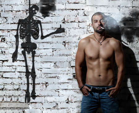 Look very tough whille smoking... as long as you live.の写真素材