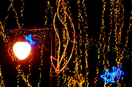 New Year decoration in a park. Beautiful holiday illumination close upの写真素材