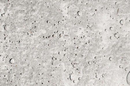 Texture of pitted gray concrete close upの写真素材