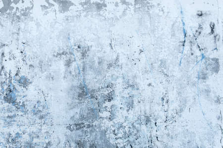 Texture of stained gray concrete with peeled whitewash and spots of old paint close up.の写真素材