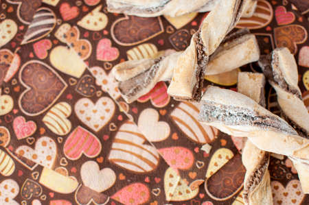 Cookies on dark napkin with image of hearts