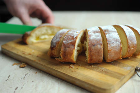 Man hands cutting pineapple pie close up