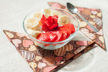 Bowl of cottage cheese with strawberry and banana. Close-up, selective focus.の写真素材