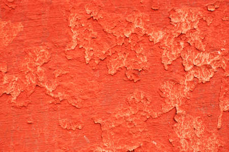 Texture of wall painted with red lead. Uneven spots on a flaked wall.の写真素材