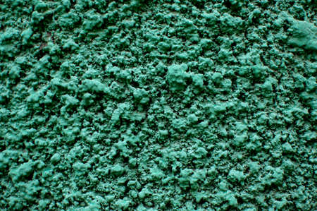 Texture of rough plastered green wall. Grungy color plaster wall texture background.の写真素材