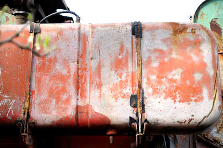 Aged fuel tank of old combine-harvester close-upの写真素材