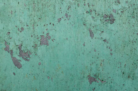 Close up peeling paint on a concrete wall, cracked paint background, old house walls exteriorの写真素材