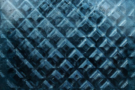 Dense thick window glass texture with rhombus pattern close-upの写真素材