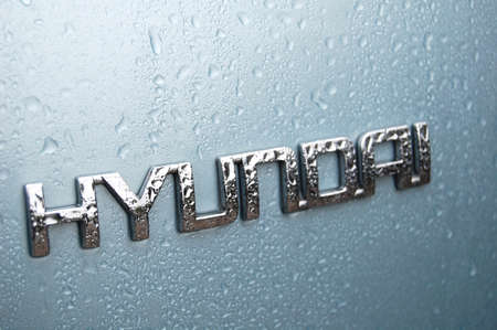 KHERSON, UKRAINE - OCTOBER 4, 2009: Logo of Hyundai Accent vehicle with raindrops close-upのeditorial素材