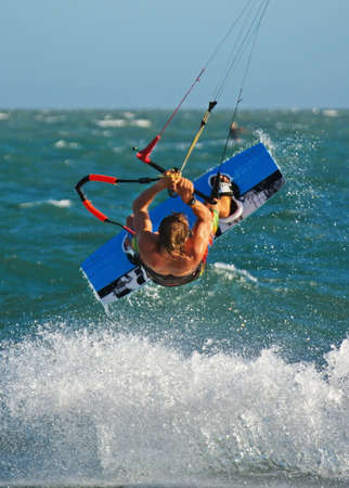 kiteboarding, kitesurfing, kiteboarder performing unhooked tricksの写真素材