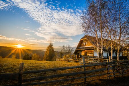 Romanian village landscape from Transylvania Romania, Autumn, November 2019 with an isolated shepherds barn houseの写真素材