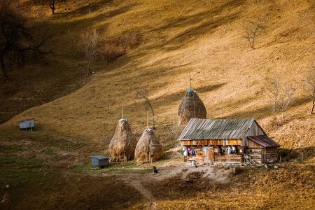 Romanian village landscape from Transylvania Romania, Autumn, November 2019 with an isolated shepherds barn houseの写真素材