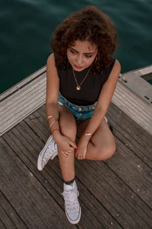 Brunette girl looking and posing.の写真素材