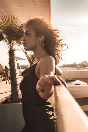 Brunette girl looking and posing.の写真素材