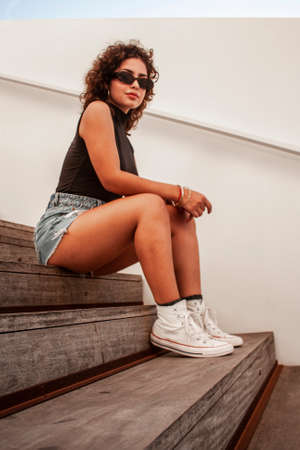 Brunette girl looking and posing.の写真素材