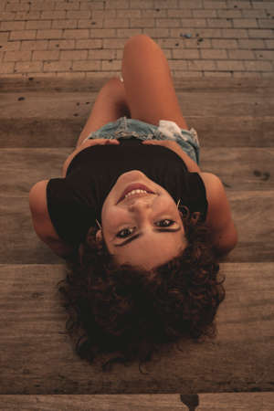 Brunette girl looking and posing.の写真素材