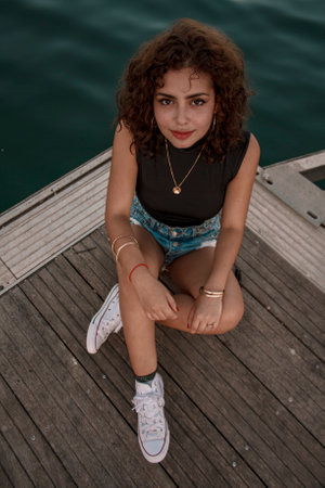 Brunette girl looking and posing.の写真素材