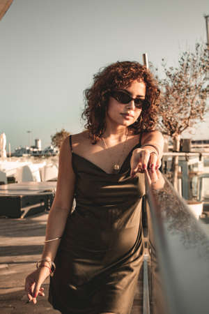 Brunette girl looking and posing.の写真素材