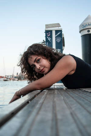 Brunette girl looking and posing.の写真素材