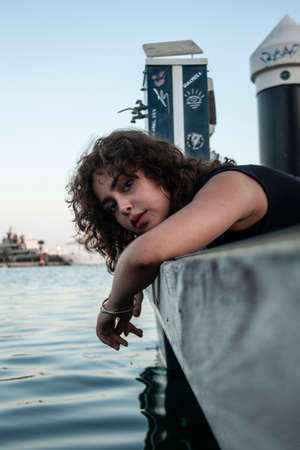 Brunette girl looking and posing.の写真素材