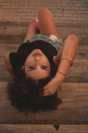 Brunette girl looking and posing.の写真素材