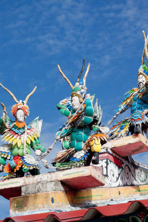 Chinese dolls on the Temple roofの写真素材
