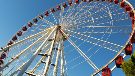 Ferris wheel on a background of blue sky, close-upのeditorial素材