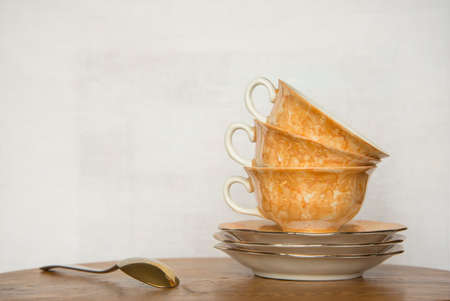 Set of coffee cups on wooden table with white backgroundの写真素材