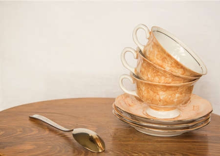 Set of coffee cups on wooden table with white backgroundの写真素材