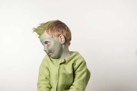 Little boy dressed as zombie on halloween look at leftの写真素材