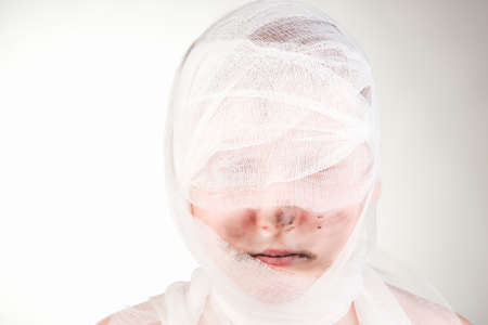Teenager boy with Mummy bandages on Halloweenの写真素材