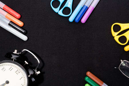 School supplies on blsck background ready for your designの写真素材
