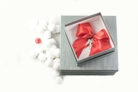 Real estate concept gift in a present box with a red ribbonの写真素材