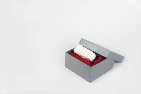 Present box with red and white xmas socks in itの写真素材