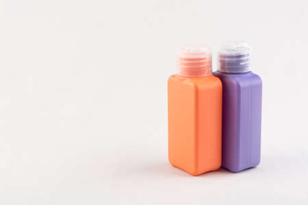 Set of small colour plastic bottles with caps on white backgroundの写真素材