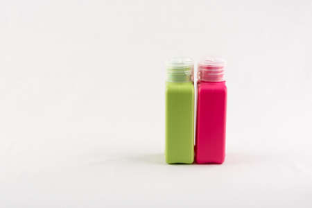 Set of small colour plastic bottles with caps on white backgroundの写真素材