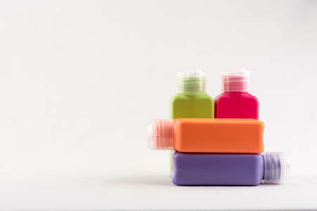 Set of small colour plastic bottles with caps on white backgroundの写真素材