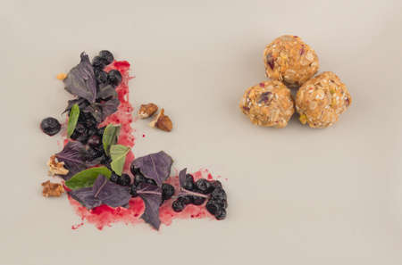 Peanut butter and oats balls with blueberry and basil saladの写真素材