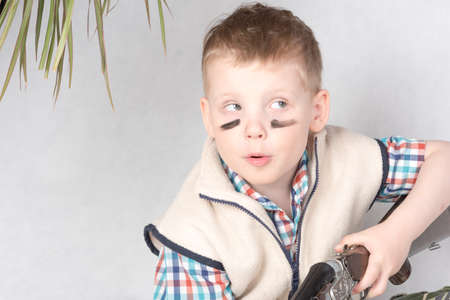 Little boy is hunter playingの写真素材