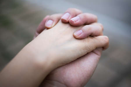 hold one's handsの写真素材