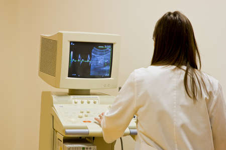Doctor analyzing aorta and sinus rhythm displayed on the ultrasound monitor 