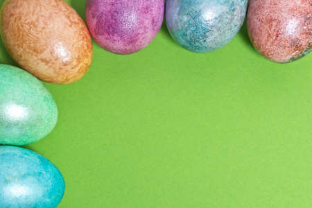 Easter egg corner border on a green backgroundの写真素材